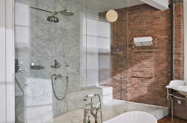 beautifully designed Dalton Georgia bathroom with frameless shower enclosure and stand alone tub.